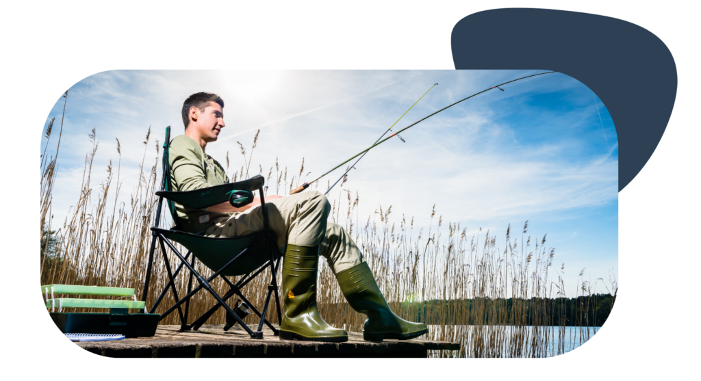 Man fishing off dock